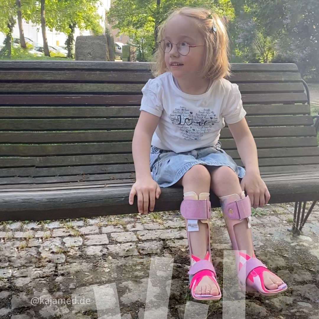 Martha can walk on a rollator with the help of her orthotics.